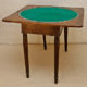 Art.TDG.1 - Tavolino Impero da gioco, utilizzabile anche come consolle, in legno di noce e piuma di noce, Toscana 1810/1820
